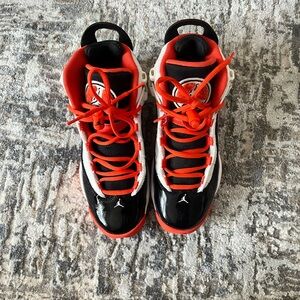 Jordan Black and Orange Sneakers with Bold Accents